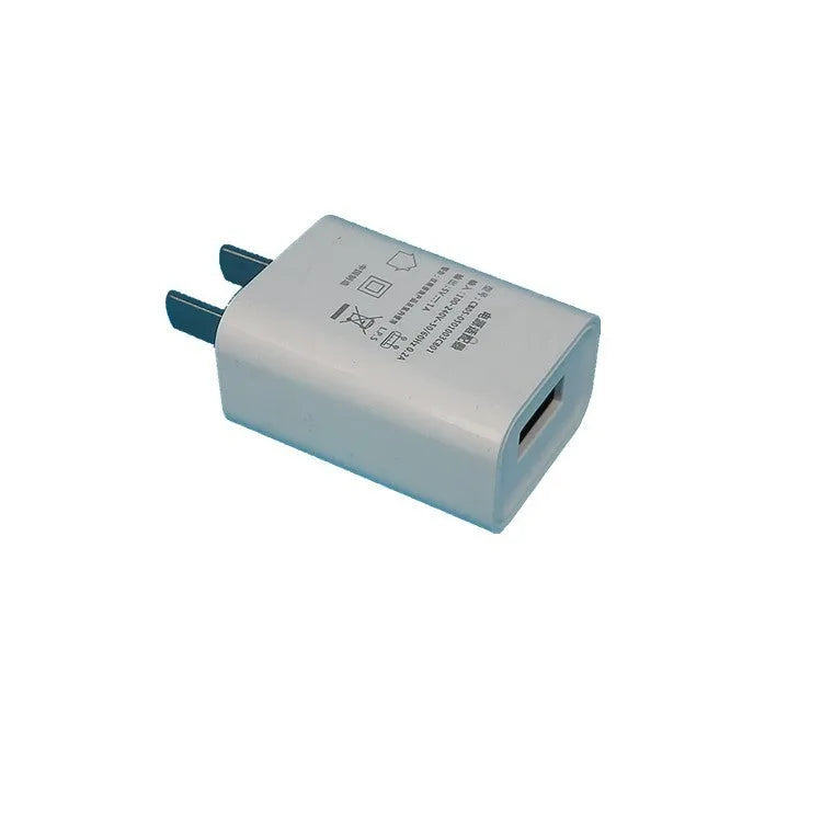 White 5V 1A USB wall charger with CE and FCC marks for China Unicom mobile phones.