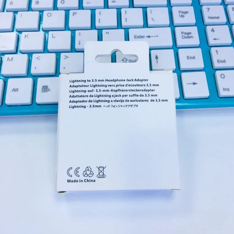 White Lightning to 3.5mm audio adapter for iPhone compatibility.