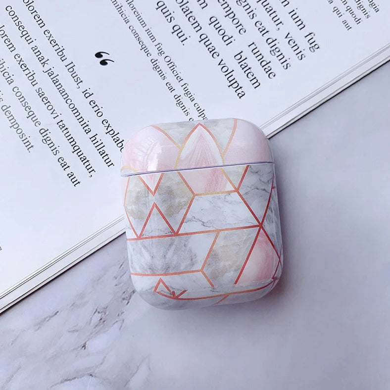 White marble pattern AirPods protective case with hard PC construction showing charging port access