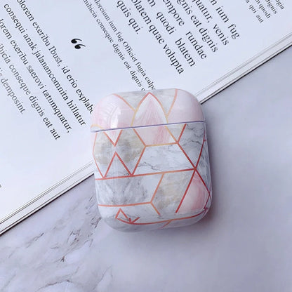 White marble pattern AirPods protective case with hard PC construction showing charging port access
