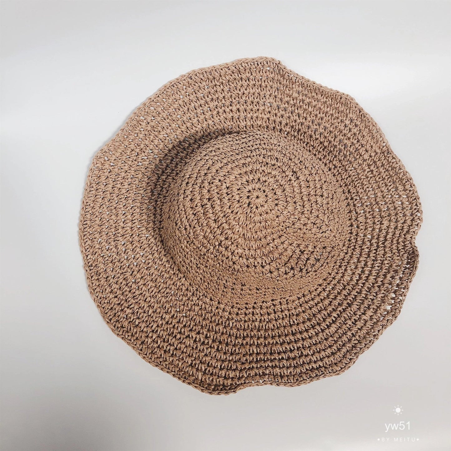 Women's foldable straw sun hat with wide brim for summer sun protection