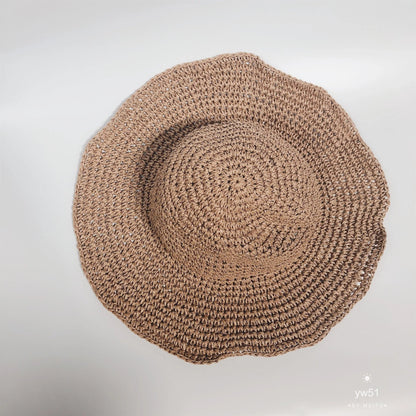 Women's foldable straw sun hat with wide brim for summer sun protection