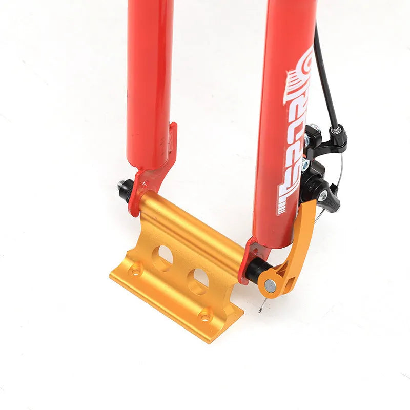Silver metal quick release fixing clamp for mounting accessories on a bicycle front fork.