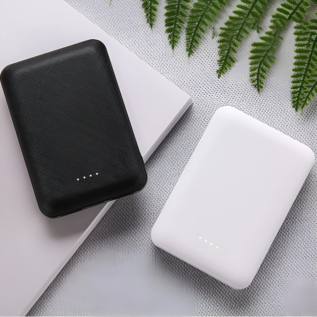 Black or white ultra-thin 10000mAh power bank showing multiple USB ports and slim 22mm profile