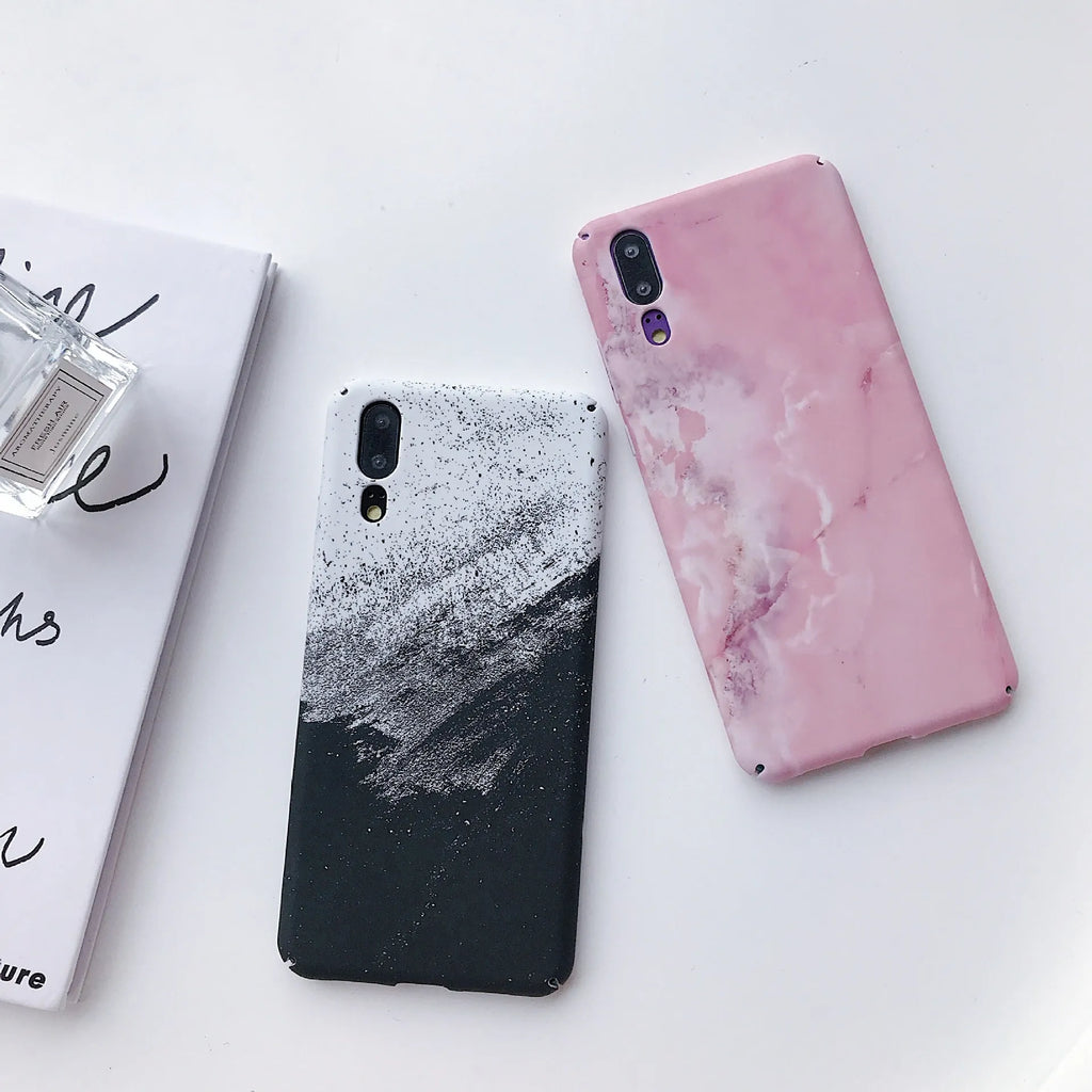 Solid black and solid pink painted phone back covers for Huawei and Honor smartphones on a white background.