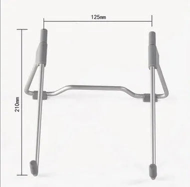 Grey aluminium and plastic mobile phone and laptop stand on a wooden desk.