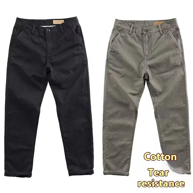 Men's slim-fit casual trousers in black with an elastic waistband and straight-leg cut.