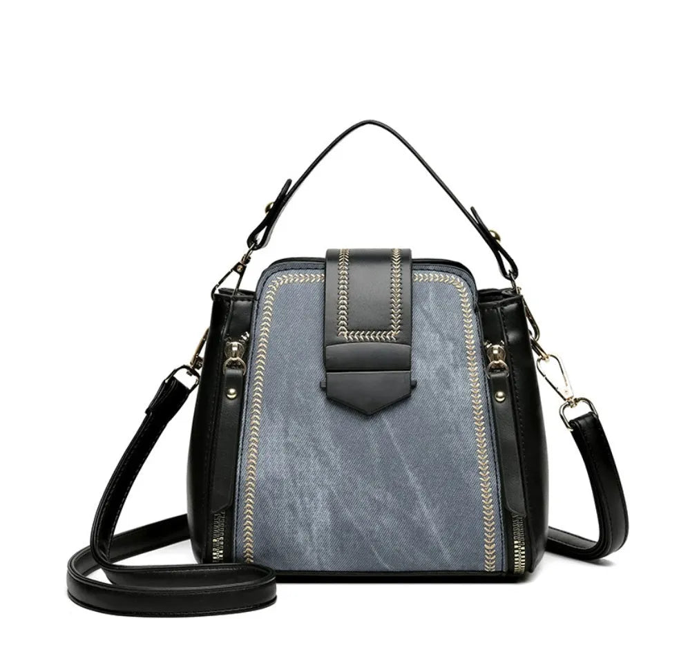 Soft black PU leather square vertical ladies handbag with textured stitching.