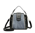Soft black PU leather square vertical ladies handbag with textured stitching.