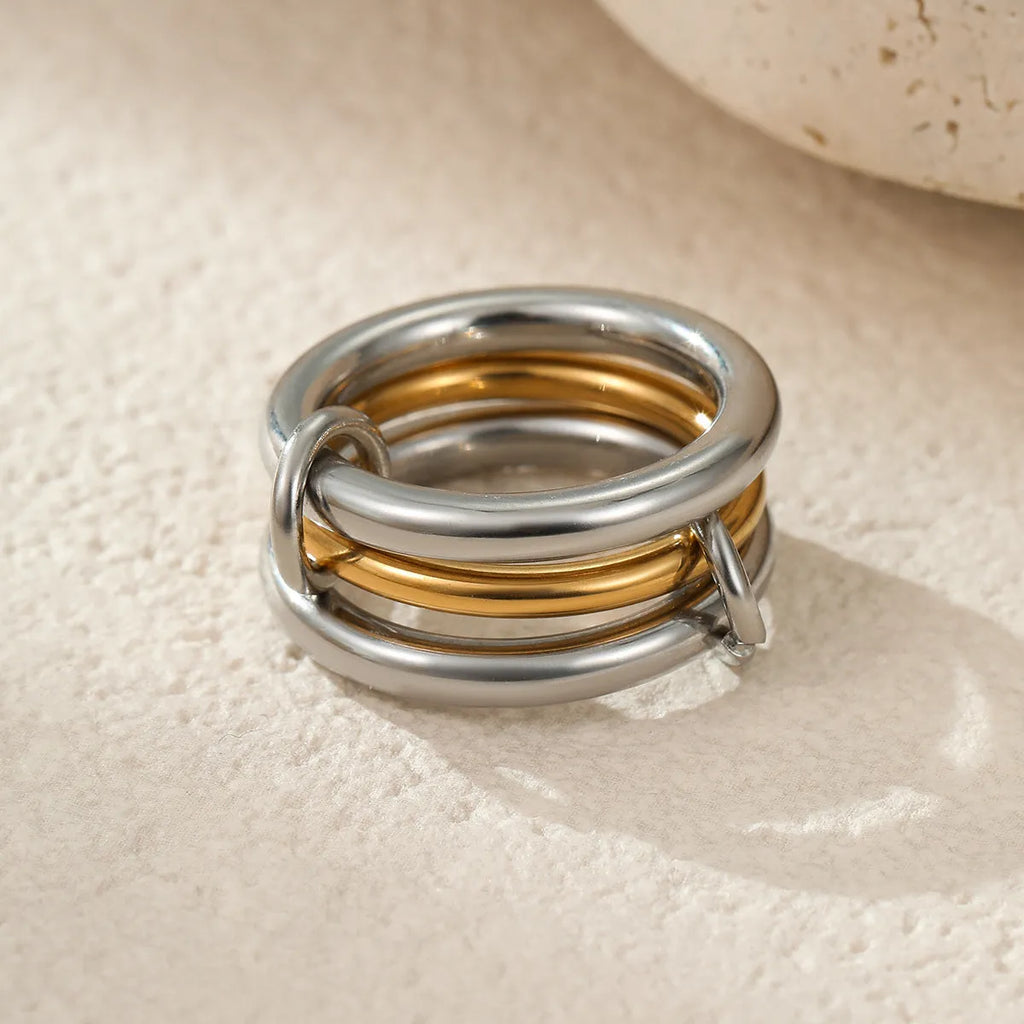 Stacked colour matching stainless steel rings with 18K gold plating in free size format