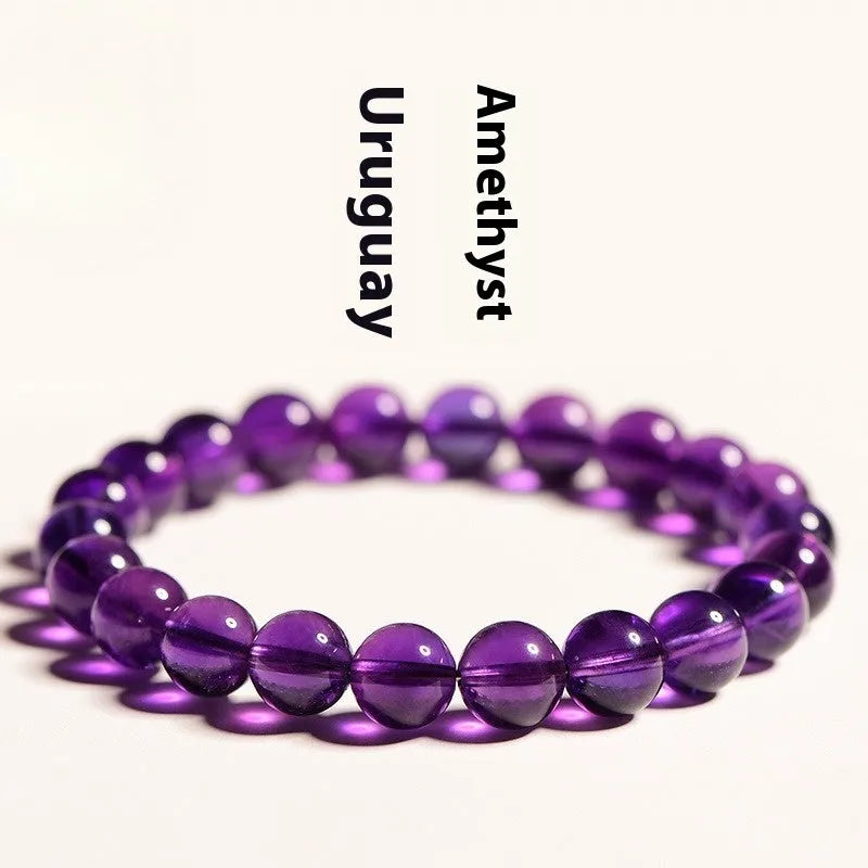 Natural amethyst Uruguay bracelet with scattered polished beads in violet tones, shown in a single circle design.