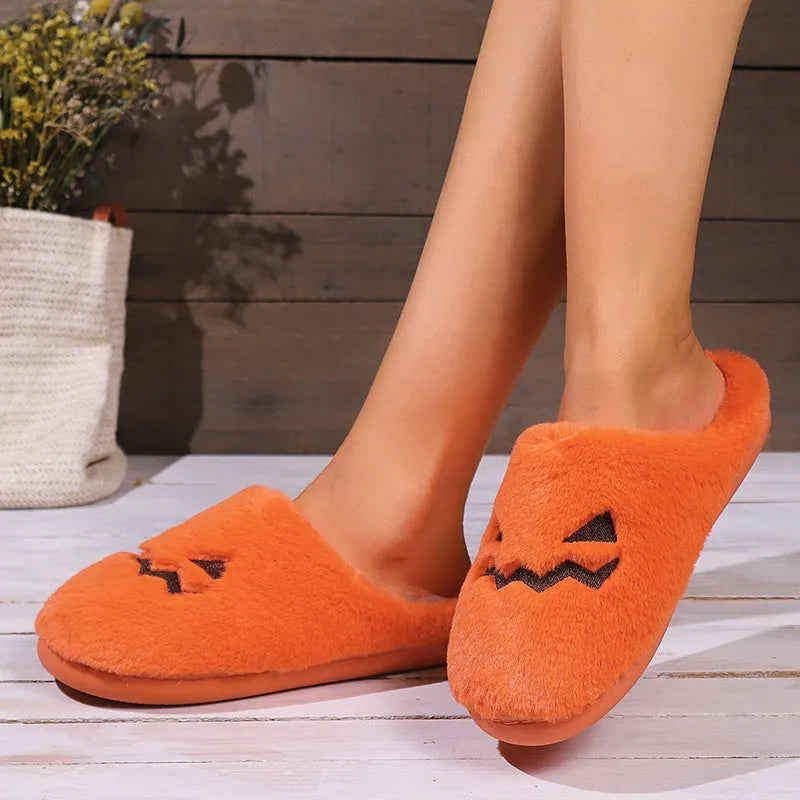 Orange Halloween pumpkin slippers with plush interior and non-slip PVC sole
