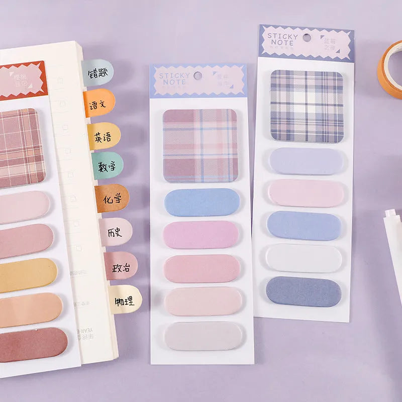 Set of eight colourful plaid and solid-colour memo pads, each with sticky notes measuring 67mm by 200mm.