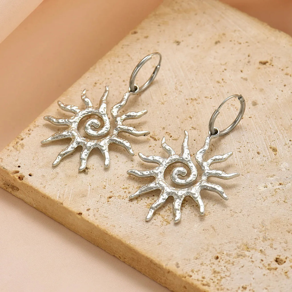 Gold sun hollow pendant necklace and earrings set with electroplated finish on zinc alloy