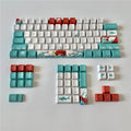 Coral Sea themed PBT plastic keycap set for mechanical keyboards, showing 104 colourful keys.