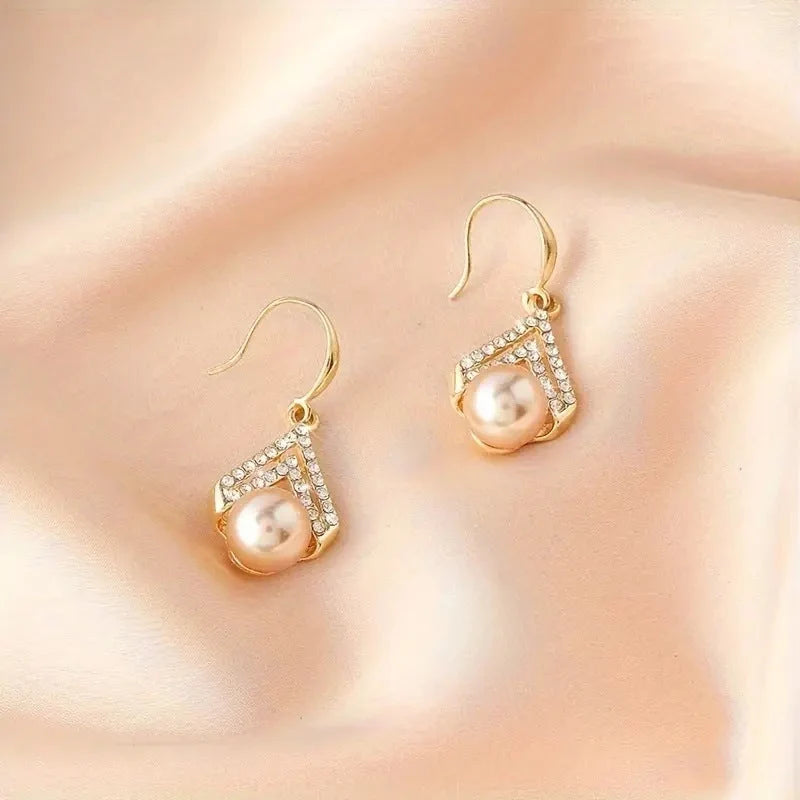 Water Drop Pearl Earrings in gold, white, and champagne with geometric design