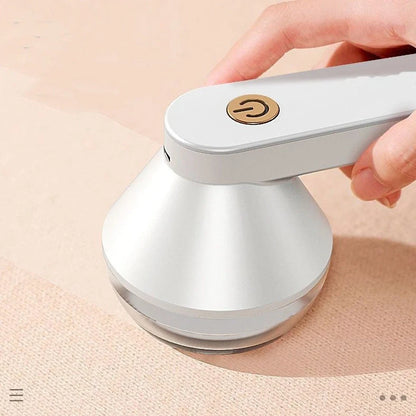 Green and white USB-powered fabric shaver device for removing pilling from clothing