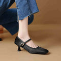 Women's black square toe stiletto ankle-strap heels with a horse hair upper.