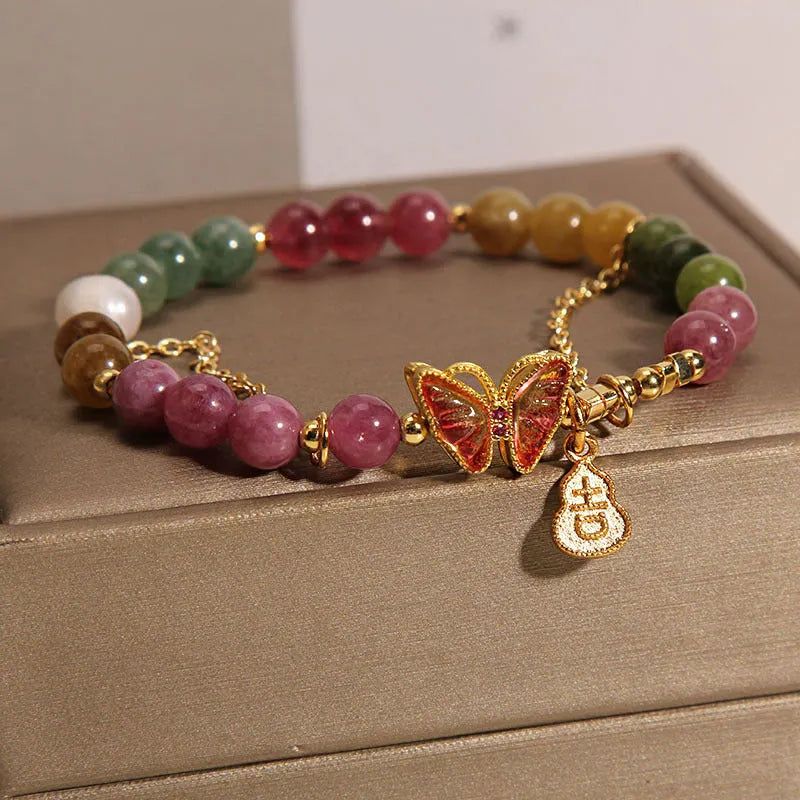 Natural jade green agate bracelet with a carved tourmaline butterfly gourd centrepiece.