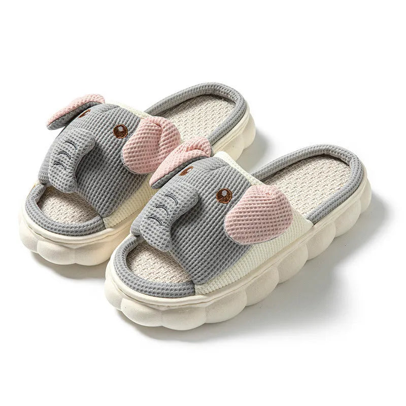 Elephant grey open-toe linen slippers for couples on a plain background.
