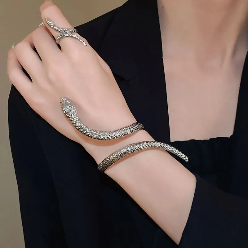 Gold twisted snake bracelet and ring jewellery set with exaggerated winding design