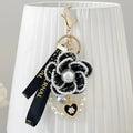 Camellia key chain with ribbon and pearl accent in Korean style, available in four colours