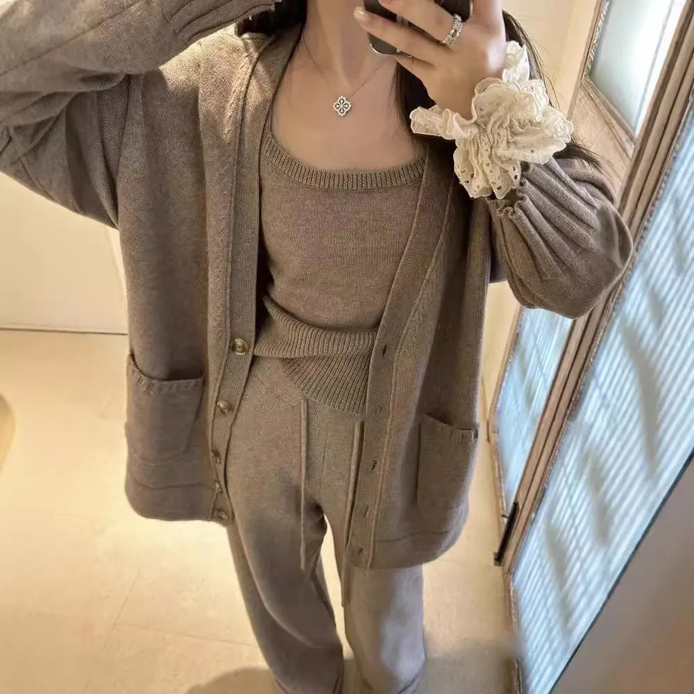 Women's light brown knitted cardigan, vest, and loose pants three-piece casual outfit set.