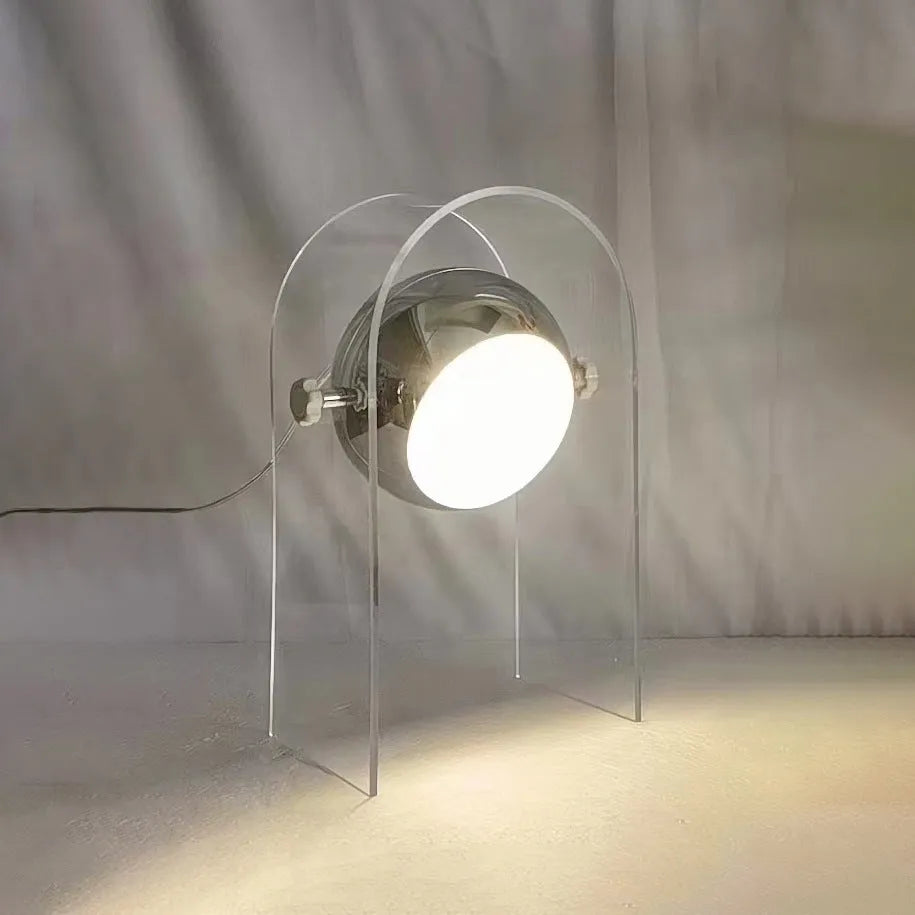 Modern minimalist acrylic table lamp with wrought iron base, 190x330mm, on a bedside table