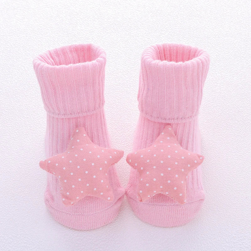 Cotton baby socks in various designs for newborns to 3-month-olds
