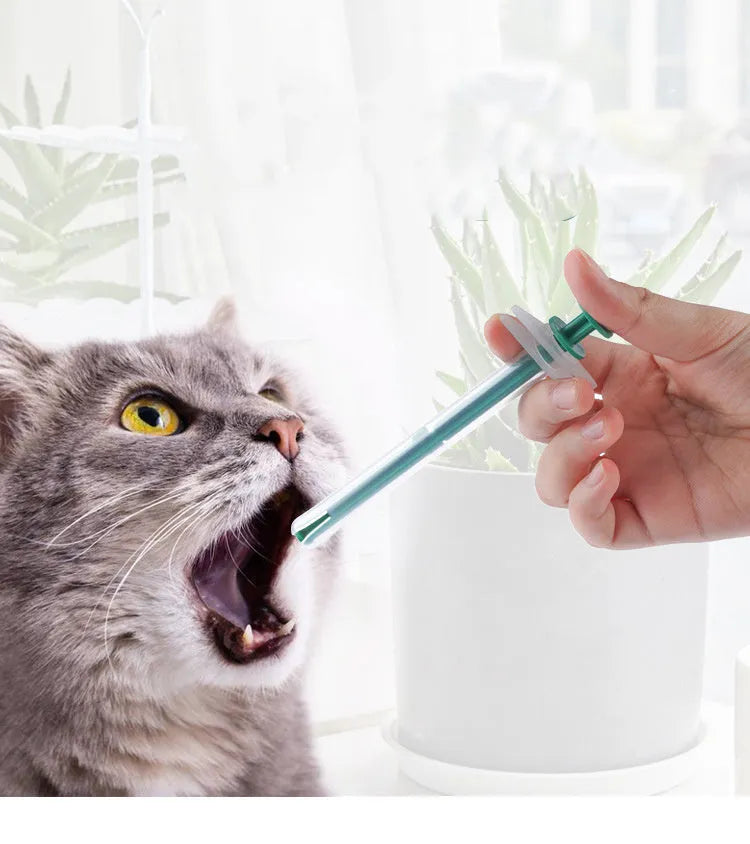 Two pet pill shooters with soft silicone tips in different sizes for administering tablets to cats and dogs