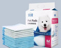 Pack of disposable thickened dog urine pads showing adhesive backing and size comparison of S, M, L, and XL pads.