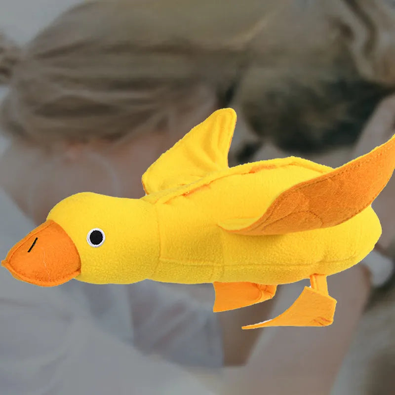 Yellow teddy dog toy with duck doll attachment for training with sounds and food leaks