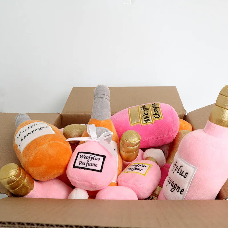 Soft green plush dog toy shaped like a wine bottle with a squeaker inside.