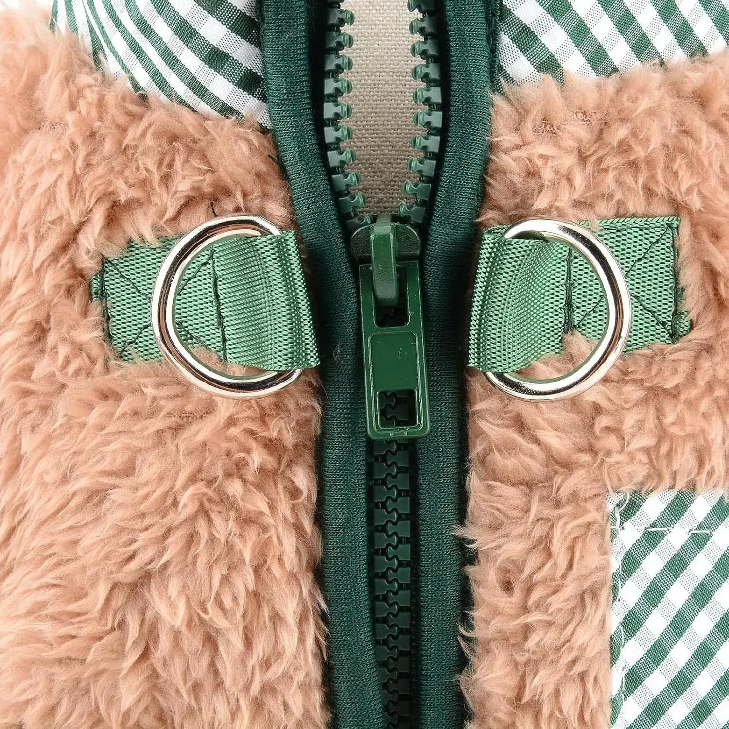 Green plush fleece dog jumpsuit on a small dog, showing zipper back and leg coverage.