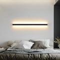 80cm long black aluminium LED strip wall light with a polycarbonate shade and touch control for colour changing.
