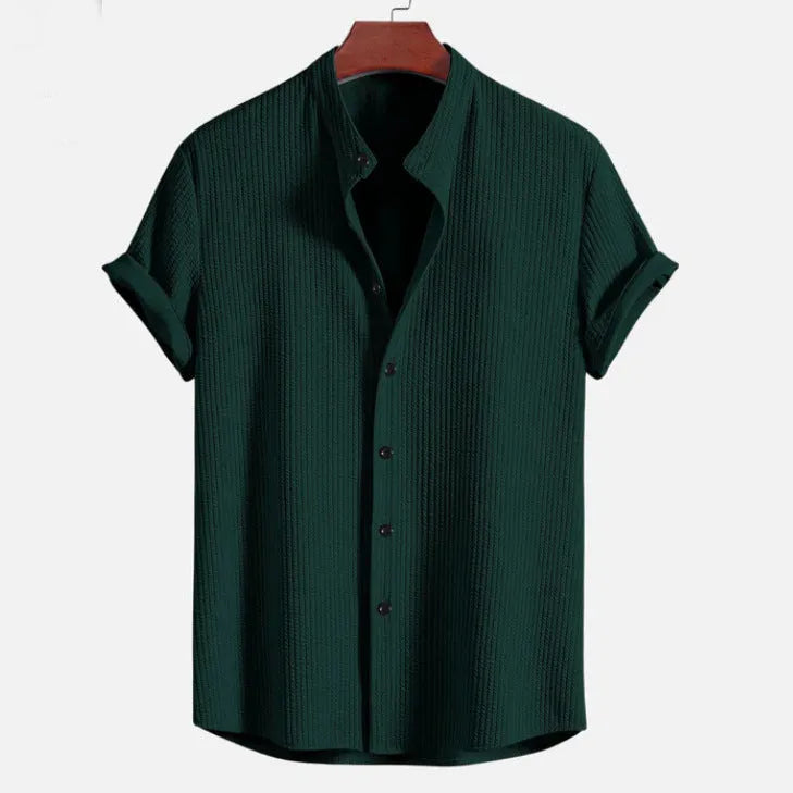 Short sleeve loose polyester fibre men's summer shirt in light blue, shown front view on plain background