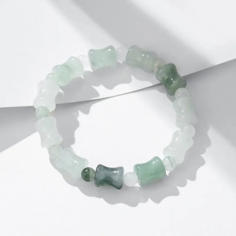 Tianshan Emerald and natural chalcedony diamond-cut beaded bracelet with coconut shell beads and a safety lock.