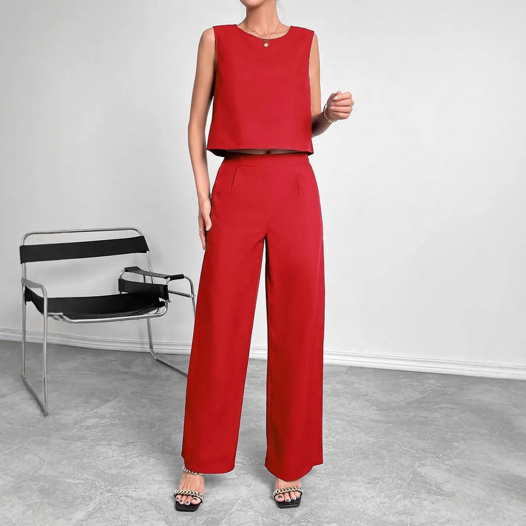 Red polyester two-piece set showing sleeveless top and wide leg trousers on Asian size mannequin