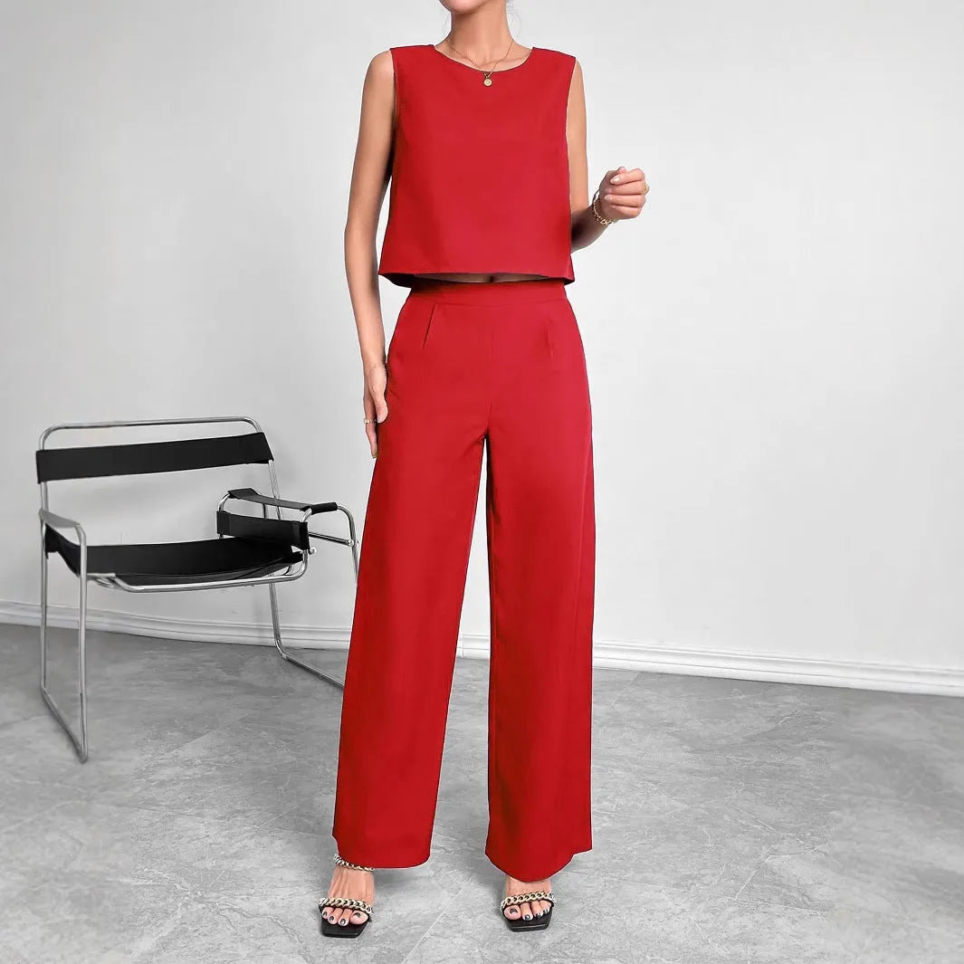 Red polyester two-piece set showing sleeveless top and wide leg trousers on Asian size mannequin