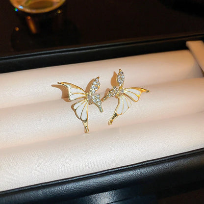 Rhinestone-dripped butterfly stud earrings in alloy with diamond treatment, available in colors A128 and A129