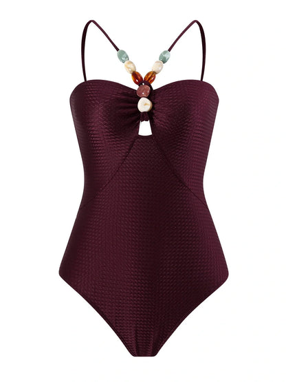 Women's one-piece swimsuit with hollow gem sling design in sapphire blue colour