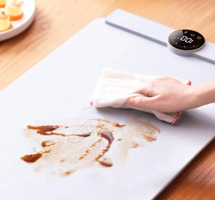Elegant grey silicone flexible foldable electric warm chopping board with digital display on a kitchen counter