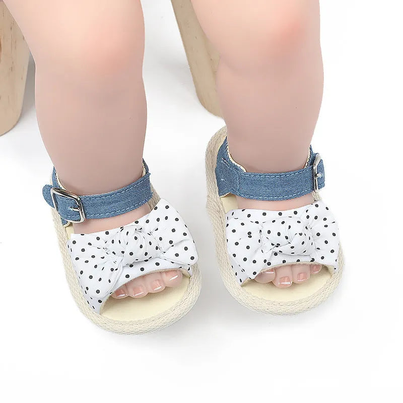 Black and white Velcro toddler shoes with low tube height design for babies 0-18 months