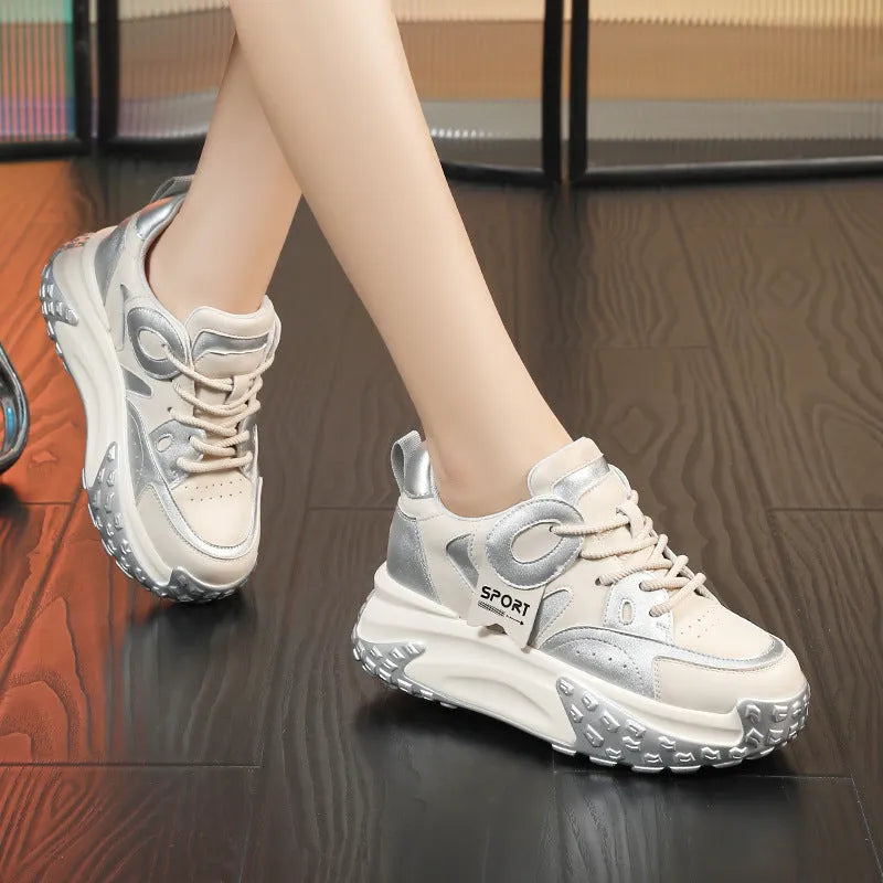 A pair of thick-soled leather casual shoes with a wedge heel and front lace-up, shown in one of the available colours.