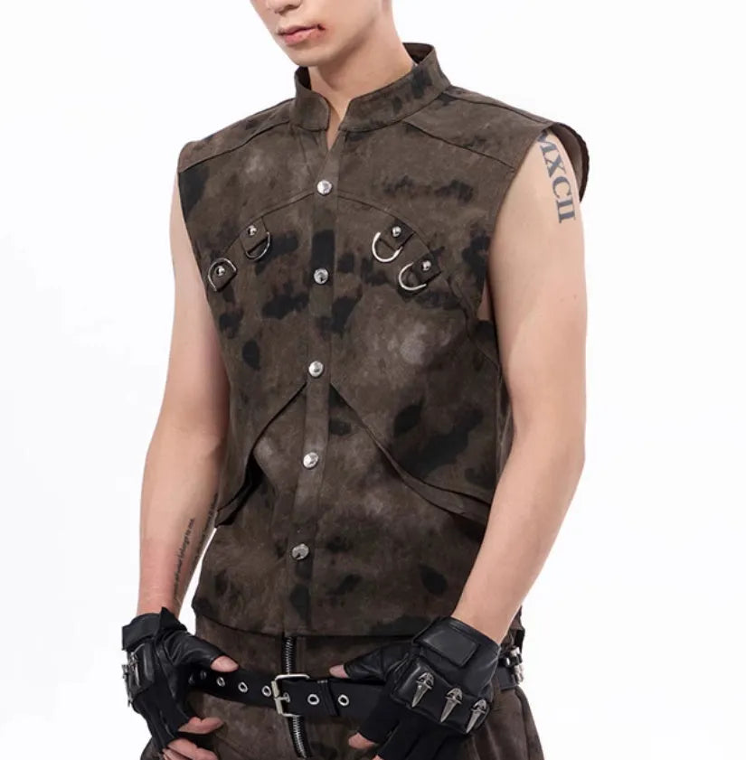 Camouflage pattern denim vest and matching trousers laid flat, showing button front and semi-high collar.