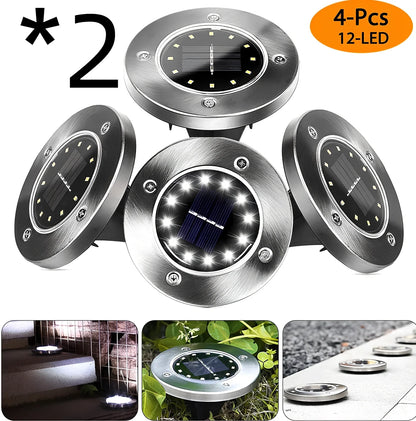 8LED waterproof solar garden light staked in lawn with warm glow, IP65 rated for rain resistance