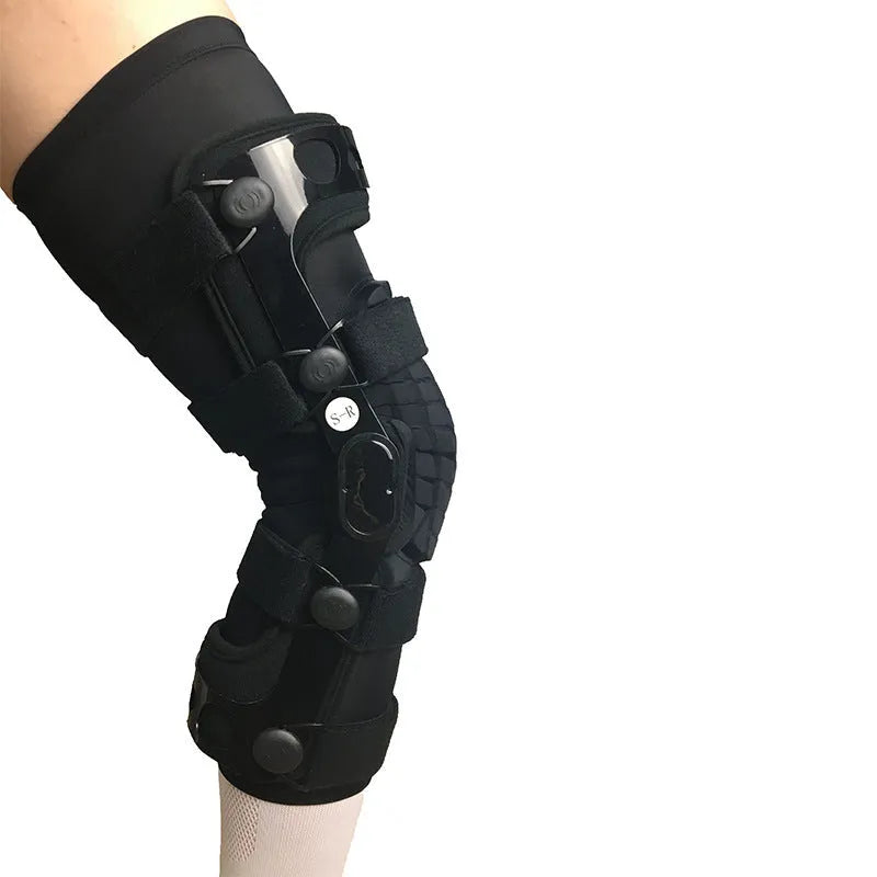 Black anterior ligament knee supporter with adjustable straps and hinge joints shown in size M-R format