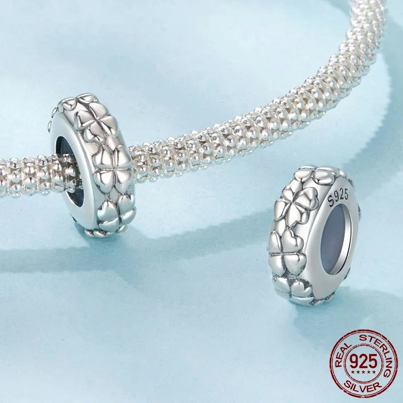 Four-leaf clover shaped S925 sterling silver spacer bead with pearlescent finish, 1.0cm height