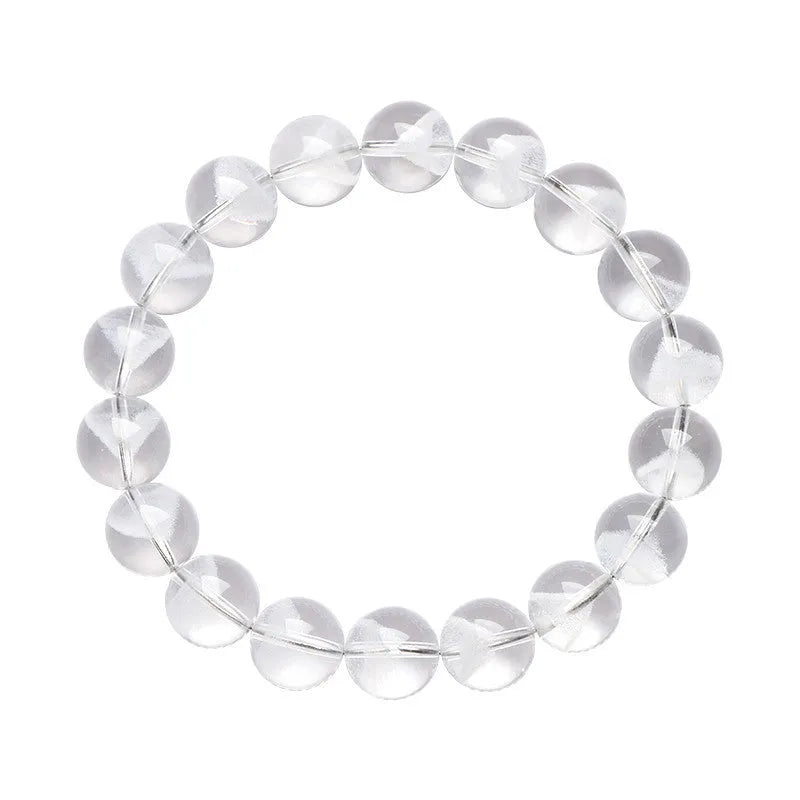 Women's adjustable white crystal bracelet with a pyramid bead and ruyi charm, shown on a wrist.