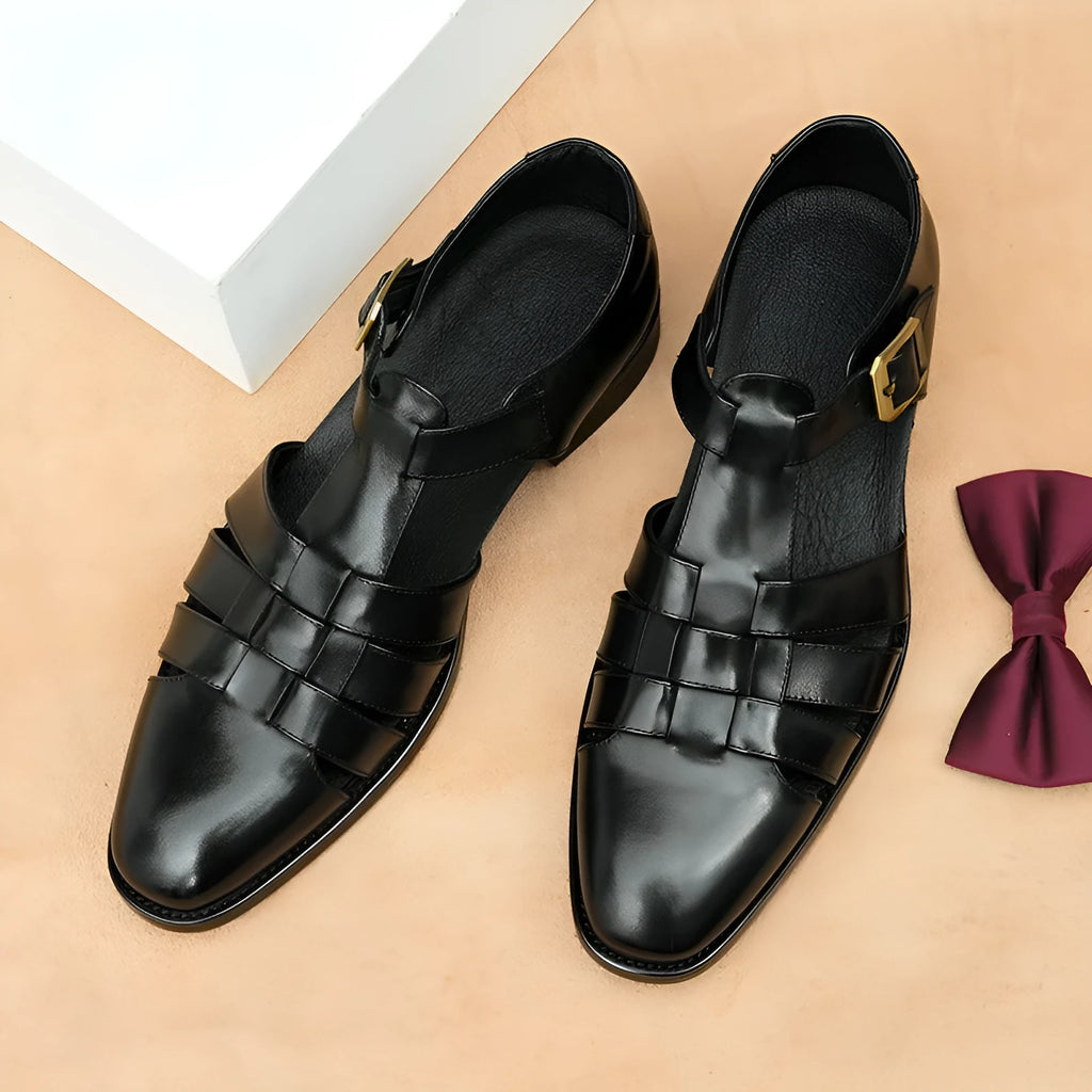 Men's black retro leather sandals with a cowhide upper and visible stitching.